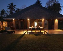 The Villa patio by night with undercover table and chairs for 6 - Ifiele'ele Plantation luxury self-contained holiday home in Samoa